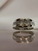 1.25 TCW lab diamond channel Set wedding band in 14k white gold.
