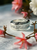 1.25 TCW lab diamond channel Set wedding band in 14k white gold.