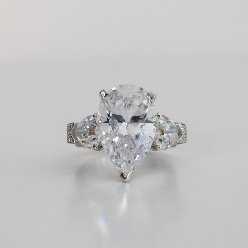 Eye-Catching 8 Carat Pear Shape IGI Certified Cubic Zirconia Ring with Heart Shape and Pave Accents - 12.75TCW