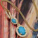 Turquoise in Halo Drop Pendant in 14K Yellow Gold