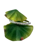 Narrow wedding band with round cubic zirconia stones 14k white gold
